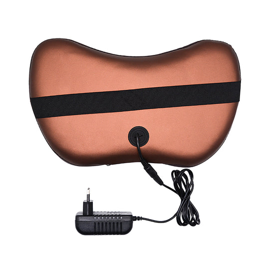Back of the brown HaloKnead massage pillow with its black elastic strap and plug-in wall adapter
