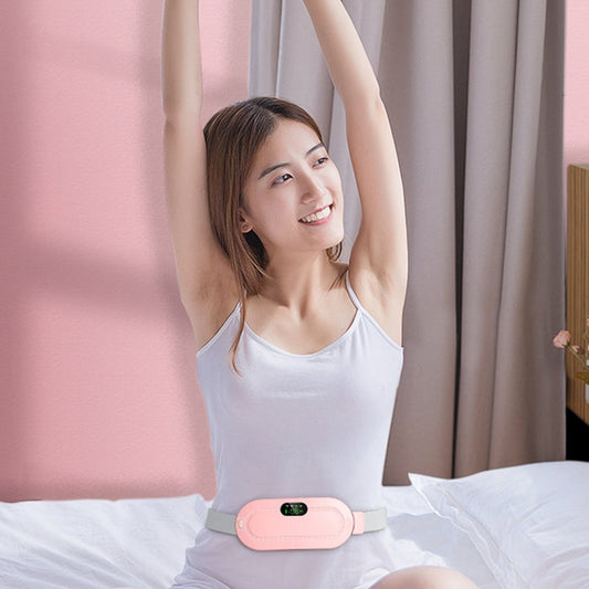 Woman wearing the pink HaloCalm period heating belt around her waist