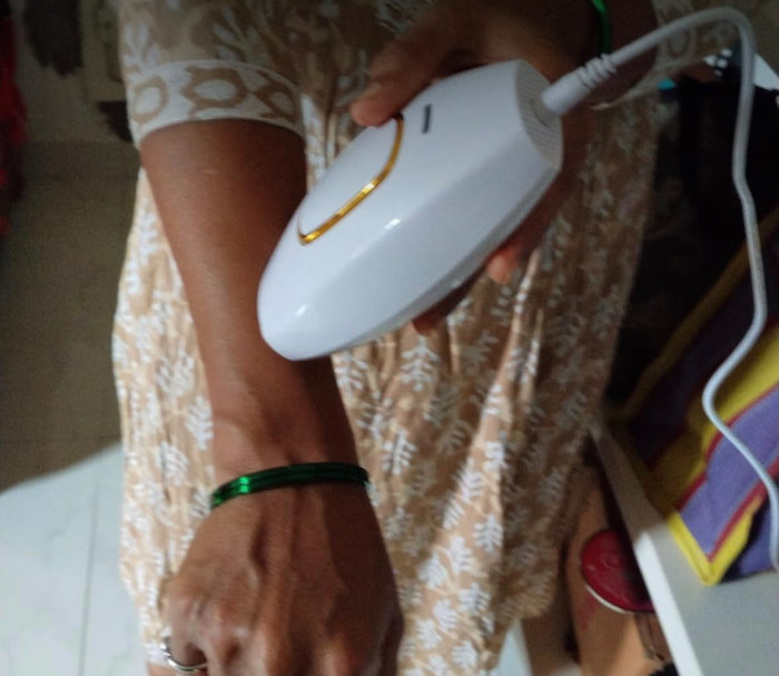 Real photo of the HaloSilk IPL device being used on the arm