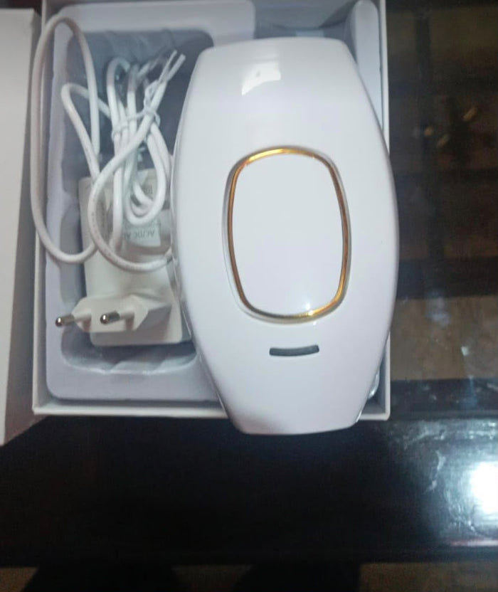 Real photo of the HaloSilk IPL device and charger in the box